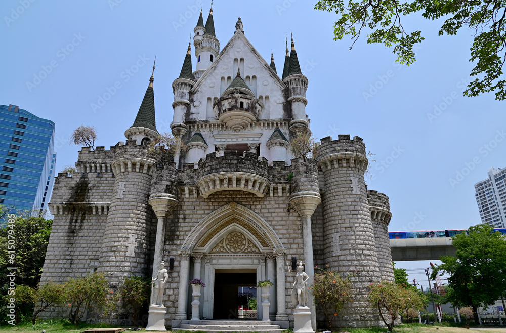 BANGKOK, THAILAND - JUNE 21, 2023 : The Beautiful Ancient Old Castle at JODD FAIRS DanNeramit with blue sky background at Thailand.