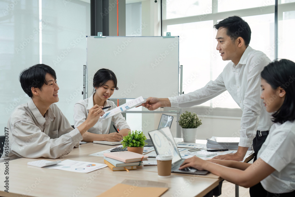 Business team people discussing analyzing investment charts the charts and graphs showing the results of their successful teamwork, typing keyboard, analyze graph plans Business team people discussing analyzing investment charts the charts and graphs showing the results of their successful teamwork, typing keyboard, analyze graph plans