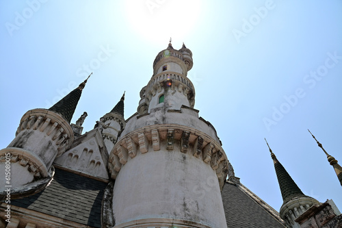 BANGKOK, THAILAND - JUNE 21, 2023 : The Beautiful Ancient Old Castle at JODD FAIRS DanNeramit with blue sky background at Thailand. photo