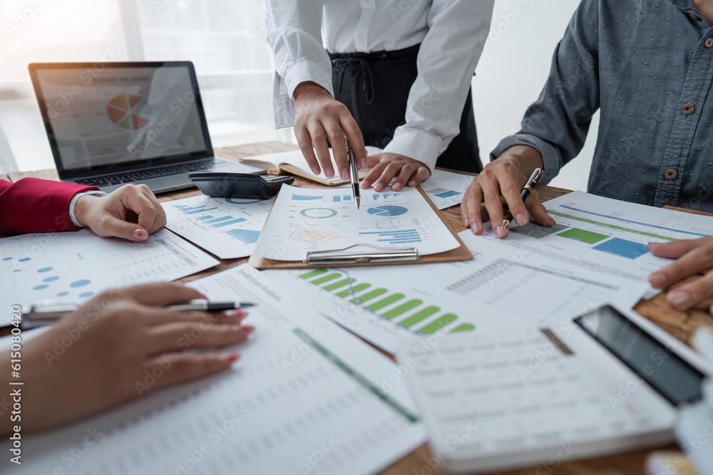 Asian business people meeting, planning and discussing chart data analysis. financial calculations and business efficiency Accounting concept. Marketing Asian business people meeting, planning and discussing chart data analysis. financial calculations and business efficiency Accounting concept. Marketing