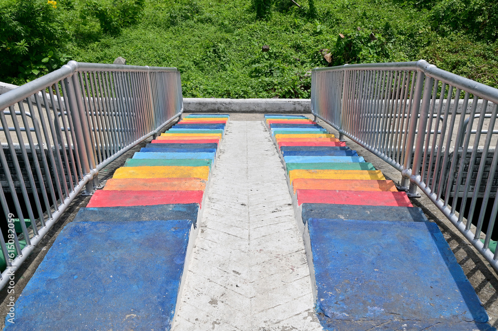 BANGKOK, THAILAND - June 21, 2023 : The Colorful Cement Stairs have silver handle with Logo Bangkok for crossing Saen Saeb Canal in Thailand. BANGKOK, THAILAND - June 21, 2023 : The Colorful Cement Stairs have silver handle with Logo Bangkok for crossing Saen Saeb Canal in Thailand.