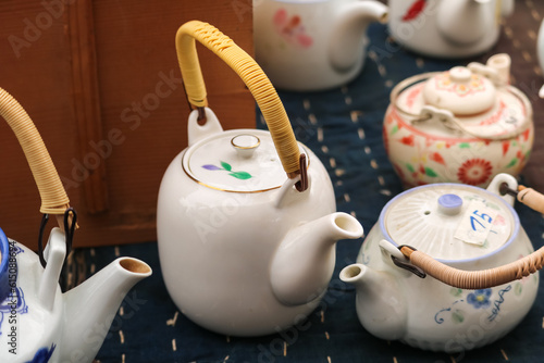 Photography Japanese floral-style porcelain teapots with wooden handle