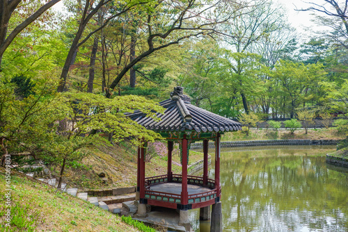 Wooden pavilion at Aeryeonji pond inside secret garden of Changdeokgung palace in Seoul, Republic of Korea photo