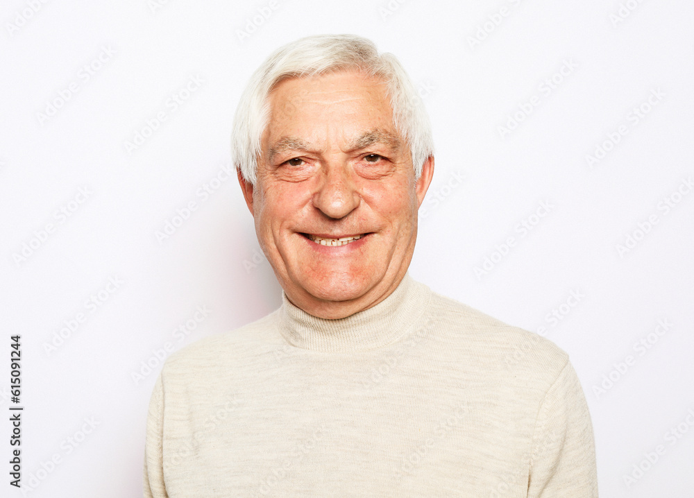 Close up portrait of happy senior man over white background Close up portrait of happy senior man over white background