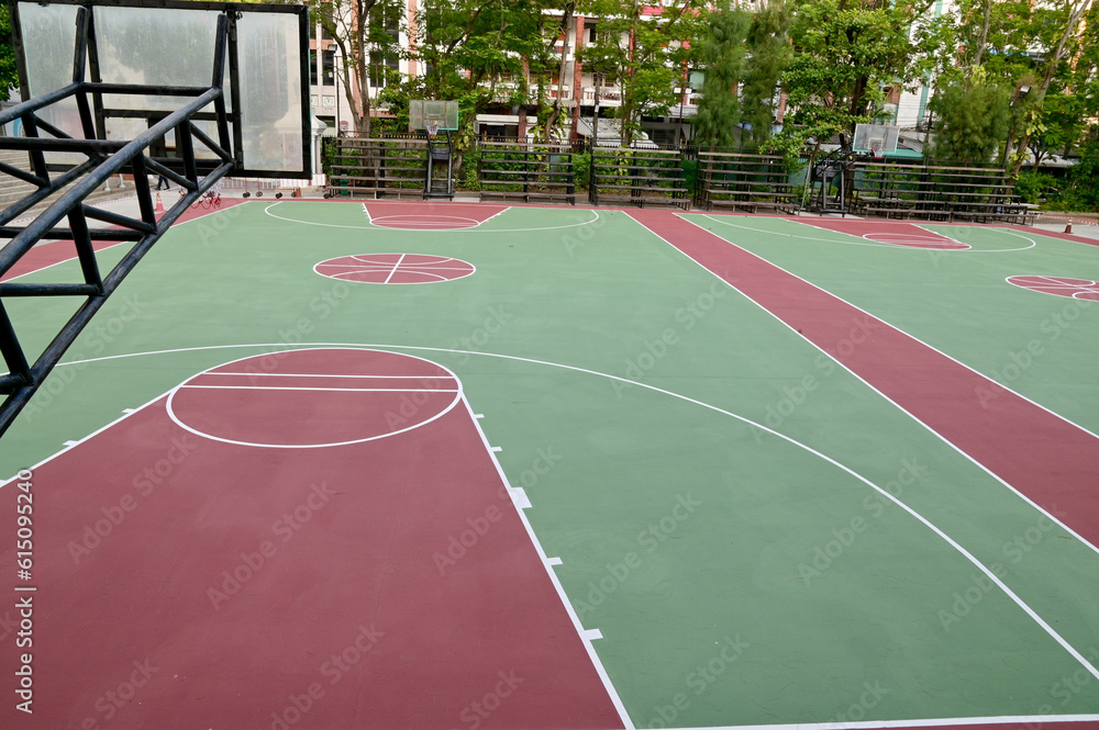 Fototapeta premium Colorful Floor volleyball, futsal, basketball, badminton court with outdoor amphitheater in the school and universities. ourdoor sports concept.