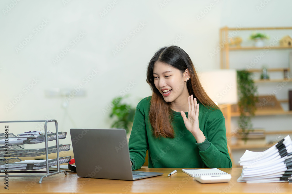 Asian woman using calculator and laptop document for doing financial mathematics on desk, tax, report, home accounting, statistics and analytical research concept online meeting concept. Asian woman using calculator and laptop document for doing financial mathematics on desk, tax, report, home accounting, statistics and analytical research concept online meeting concept.