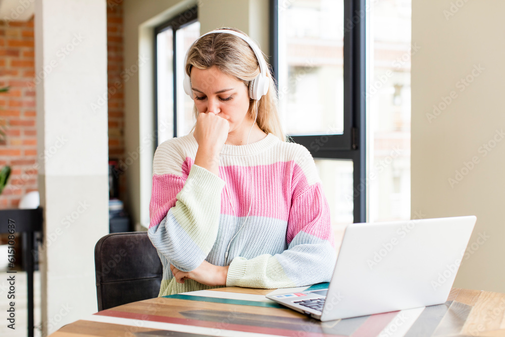 pretty young woman working at home with a laptop. house interior design pretty young woman working at home with a laptop. house interior design
