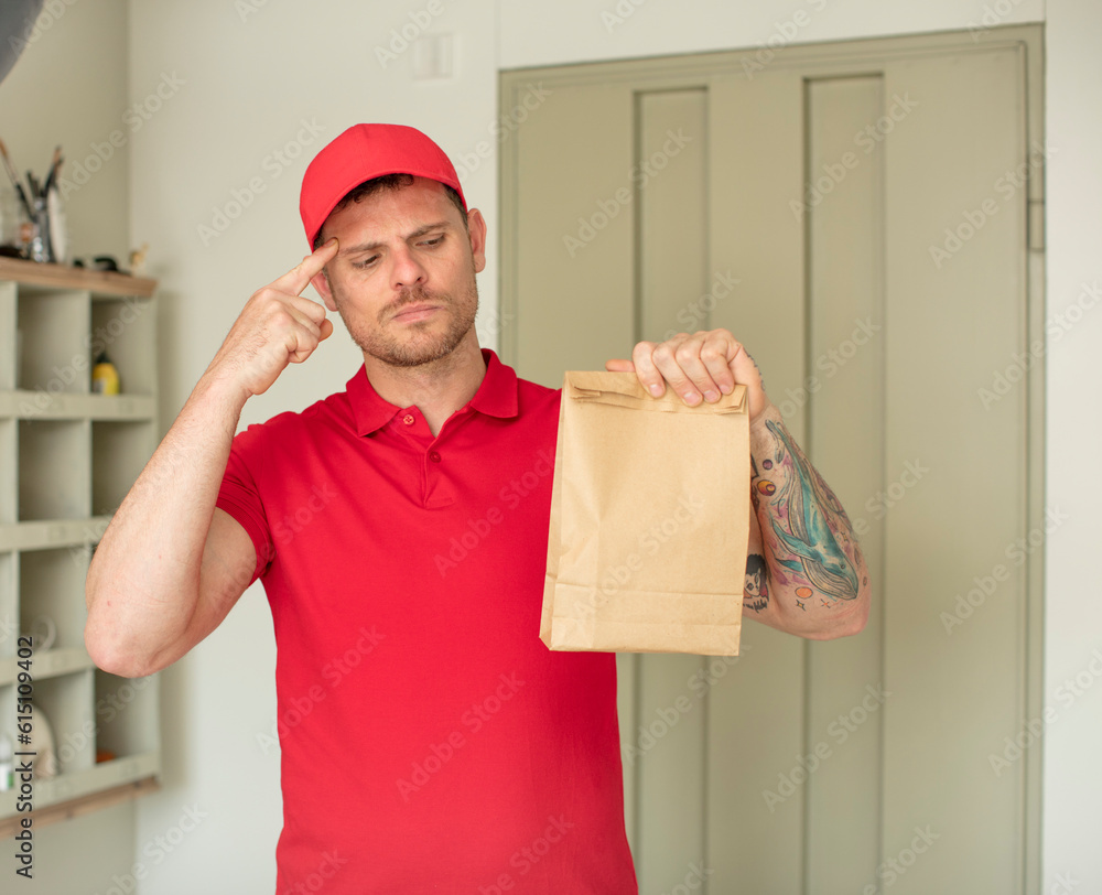 looking surprised, realizing a new thought, idea or concept. delivery take away concept looking surprised, realizing a new thought, idea or concept. delivery take away concept