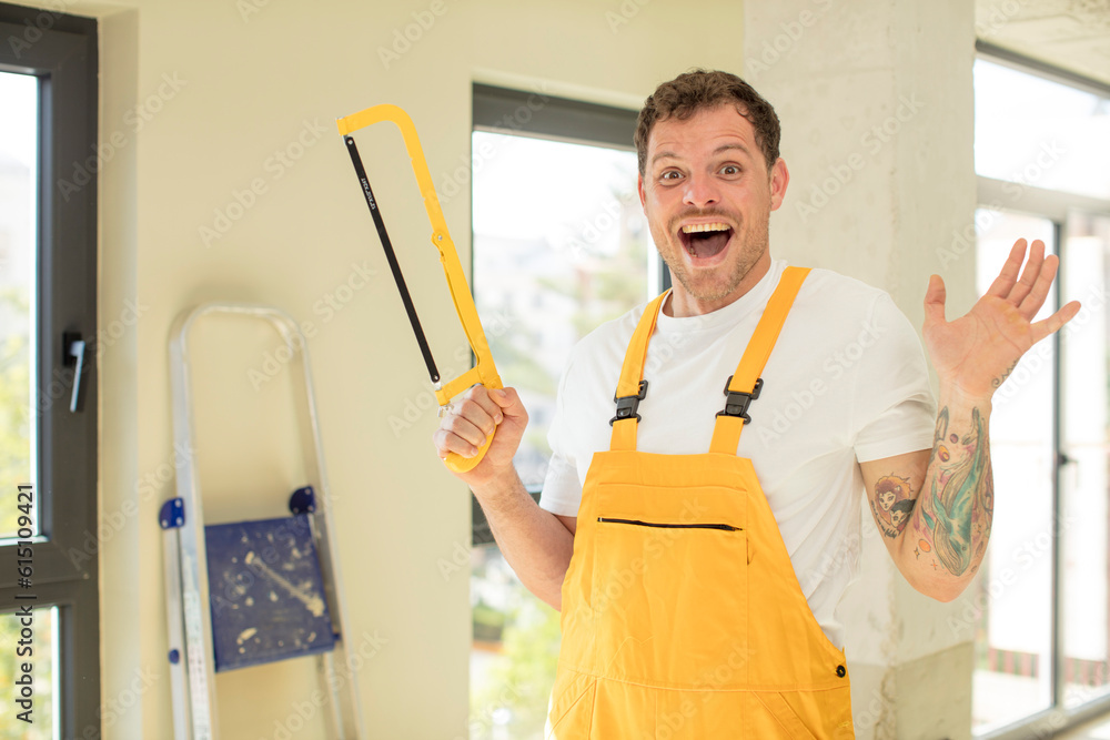 feeling happy and astonished at something unbelievable. handyman saw concept feeling happy and astonished at something unbelievable. handyman saw concept