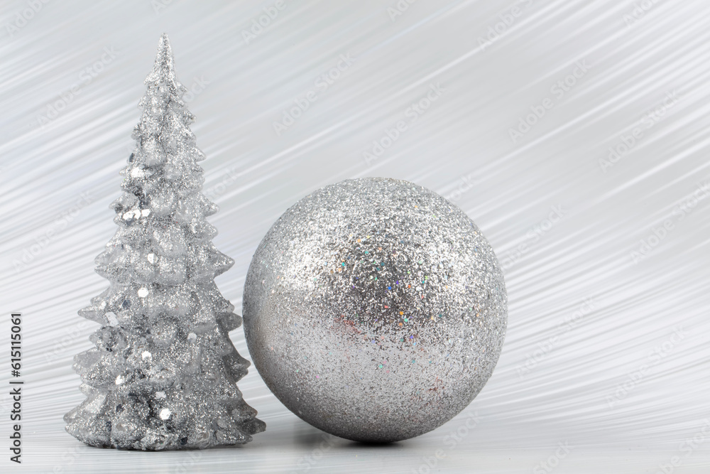 Christmas or New Year background with silver snowy tree and silver transitional decoration. Bright festive background. Christmas or New Year background with silver snowy tree and silver transitional decoration. Bright festive background.