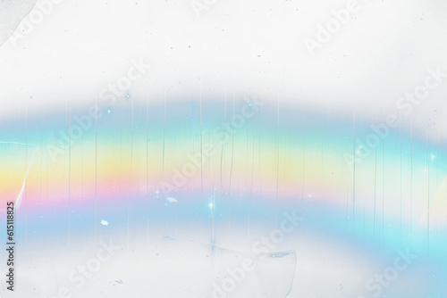 Film  distressed background with rainbow leak  effect. Abstract grunge weathered  with noise, scratches and colorful prism lens flare. Stained smeared glass overlay