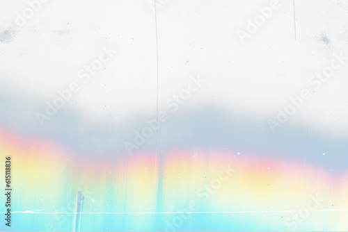 Film  distressed background with rainbow leak  effect. Abstract grunge weathered  with noise, scratches and colorful prism lens flare. Stained smeared glass overlay