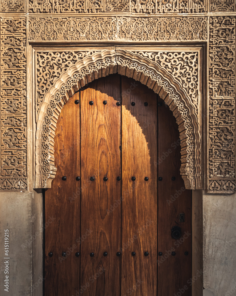 Alhambra's door intricately adorned, a portal to a world of history and beauty, beckoning with alluring details. - obrazy, fototapety, plakaty 