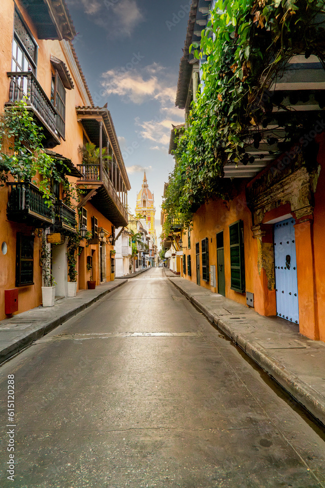 Vertical photo of Cartagena street in colombia with church and colonial balcony in old city 