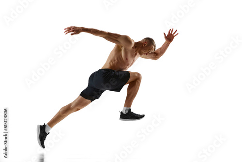 Endurance. Dynamic image of professional sportsman, shirtless muscular man in motion, running, training against white studio background