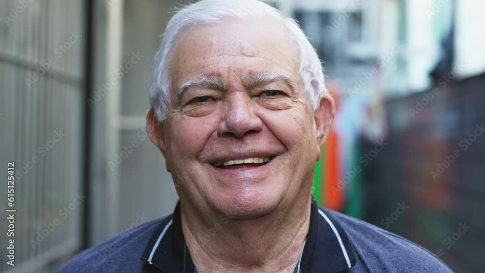 Portrait of a happy elderly senior man looking at camera laughing, close-up face of an older male caucasian person with joyful expression in 70s Portrait of a happy elderly senior man looking at camera laughing, close-up face of an older male caucasian person with joyful expression in 70s