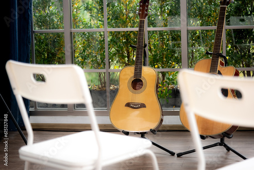 Canvas-taulu chair  and acoustic guitar. Time for hobby and leasure.