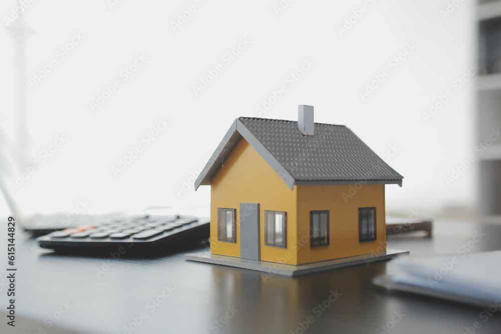 Female woman hands holding home model, small miniature white toy house. Mortgage property insurance dream moving home and real estate concept Female woman hands holding home model, small miniature white toy house. Mortgage property insurance dream moving home and real estate concept