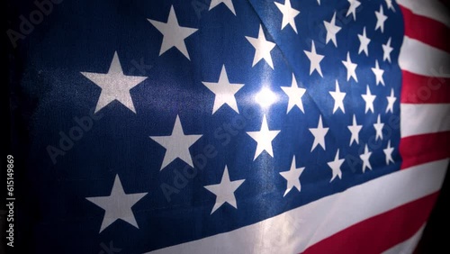 American Flag Waves In Slow Motion Backlit