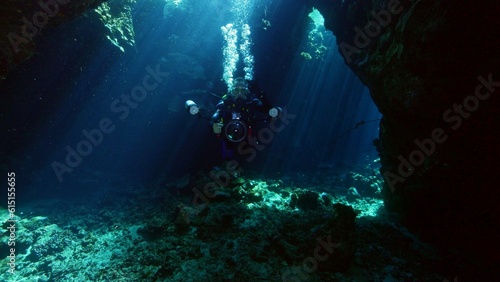 One diver exploring cave. © Jag_cz