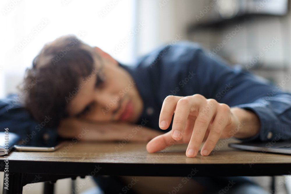 Arabic Man Exhausted Of Overworking, Resting Head On Table Indoor Arabic Man Exhausted Of Overworking, Resting Head On Table Indoor