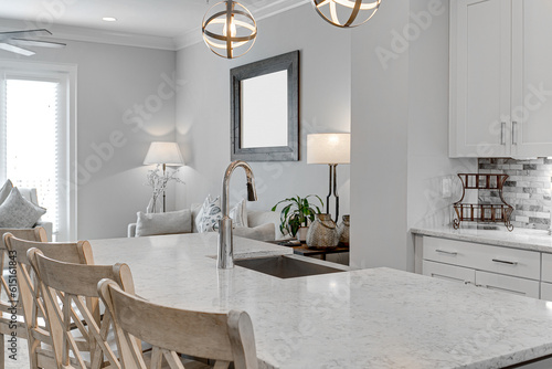 Bright White Modern Kitchen Interior Sink with Marble Countertops and Metal Pendant Lights with Blank Frame Mockup