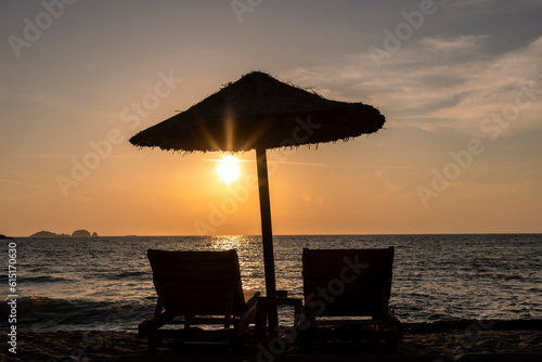 Obraz na płótnie Sun loungers and parasol in sunset on Paros island, Greece w salonie