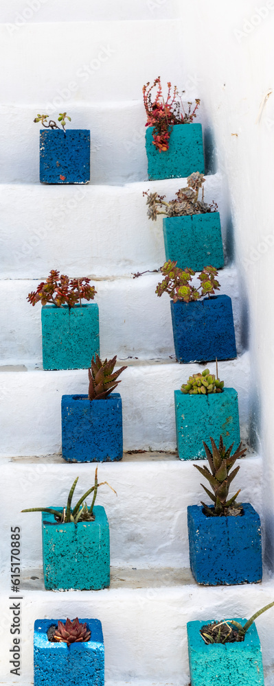 Flower pots on a staircase in Greece