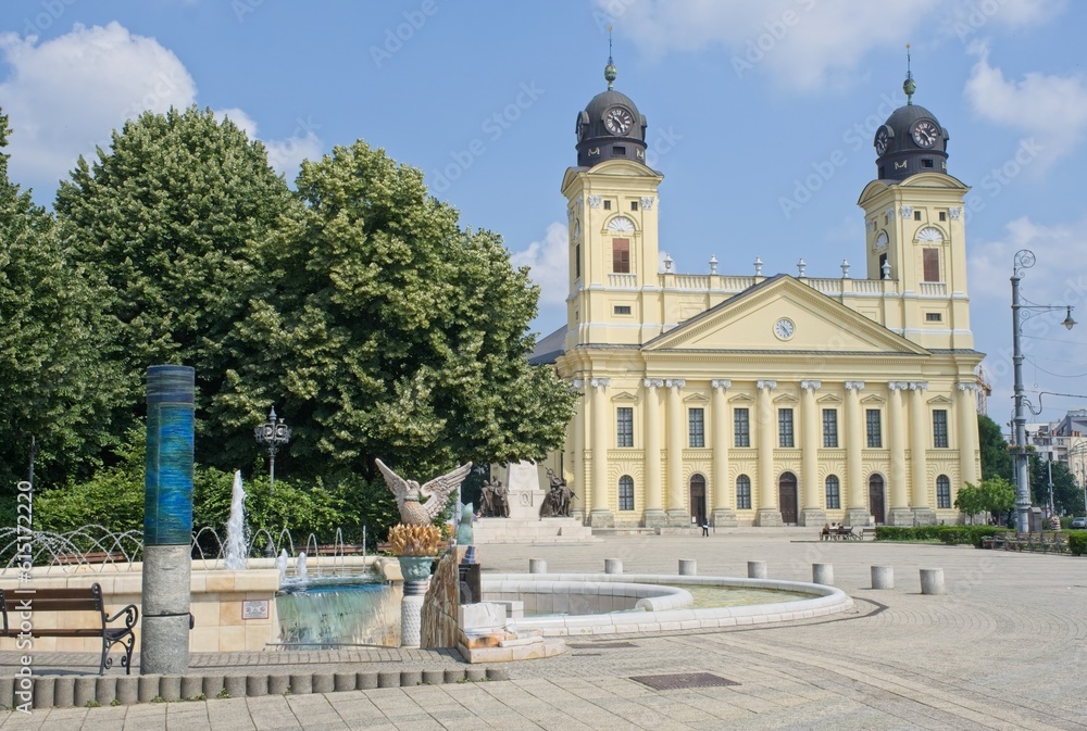 Debrecen, Hungary - Jun 18, 2023: A walking in the center of Debrecen city in northeastern Hungary in a sunny spring day. Great Reformed Church. Selective focus