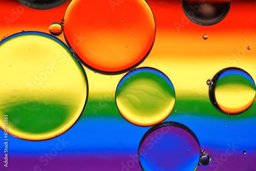 oíl droplets Background with the colors of the rainbow LGBTQ+ flag 