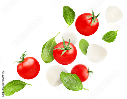 Fototapete levitation of cherry tomatoes, basil leaves and mozzarella on a white isolated b