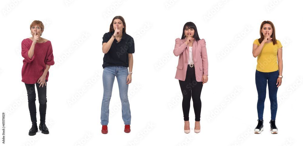 group of women show silence sign with fingers and mouth on white background group of women show silence sign with fingers and mouth on white background