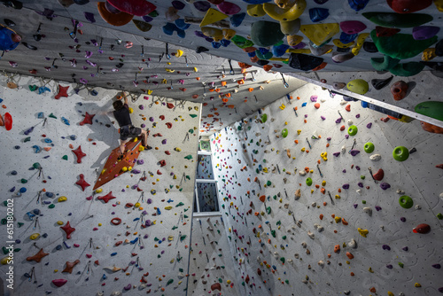 Climbing walls and boulder center. Extreme sport requiring strength and agility. People climbing photo