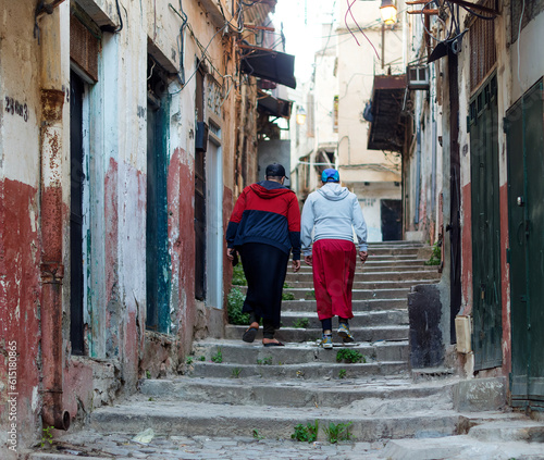 Algiers (Alger), Algeria : Street scene in the Casbah Stone stairs and ancient ottoman houses. Two men walking up the street. © Bruno