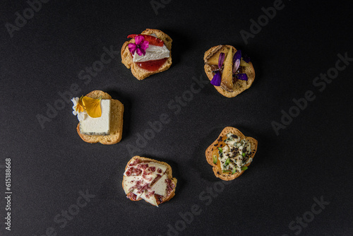 top view on various gastronomic appetizers on a black background photo