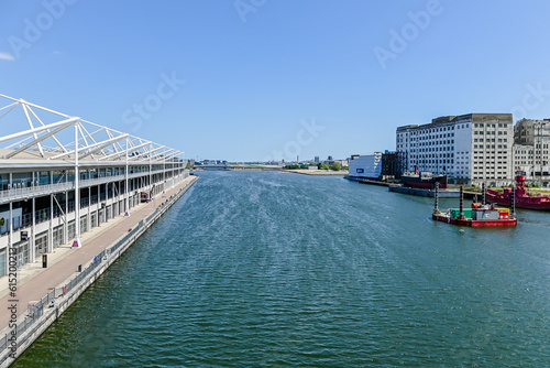 London, UK, 4 June  2023:  Aerial view of Excel Exhibition centre and Millennium Mills from bridge in middle of dock
