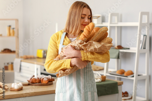 Female baker with fresh bag...