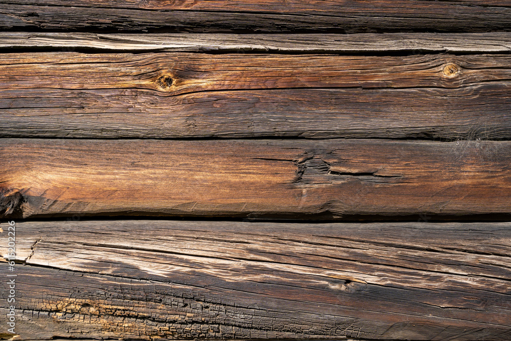 Wood texture background, weathered brown plank from the barn Wood texture background, weathered brown plank from the barn