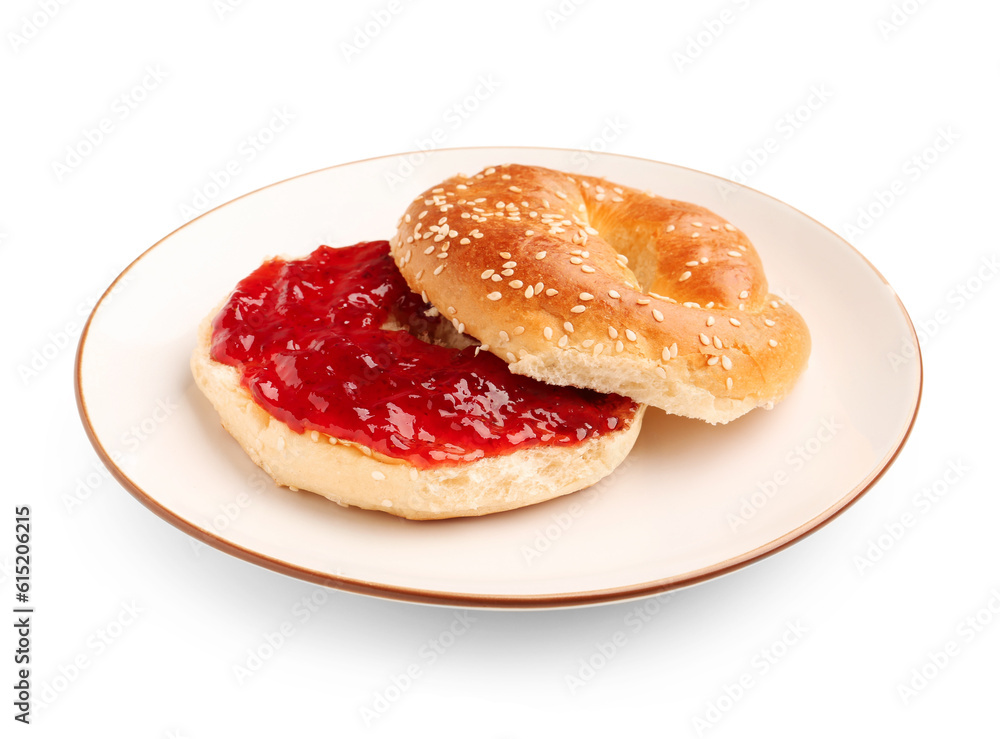 Plate of tasty bagel with strawberry jam on white background Plate of tasty bagel with strawberry jam on white background