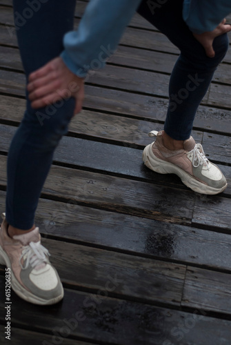 View on aestetic body of a girl in gym suit in the park