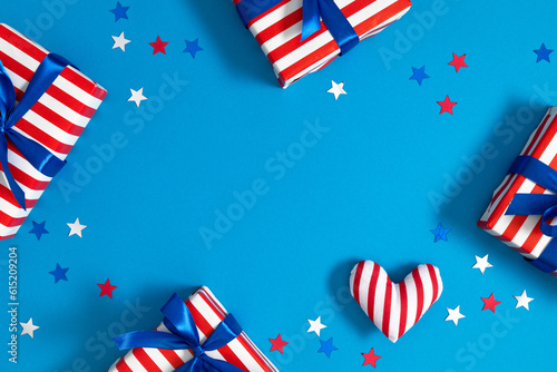 4th of July, USA Presidents Day, Independence Day, US election concept. Gift striped box with bow, heart, star confetti on blue background. Flat lay, top view, copy space