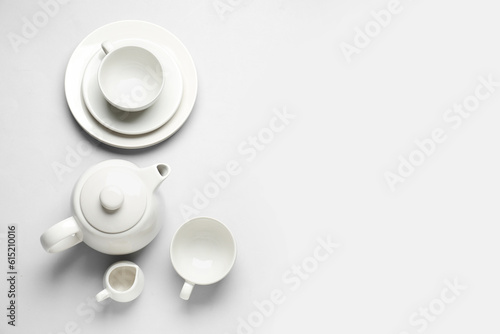 Stylish tea set on grey background