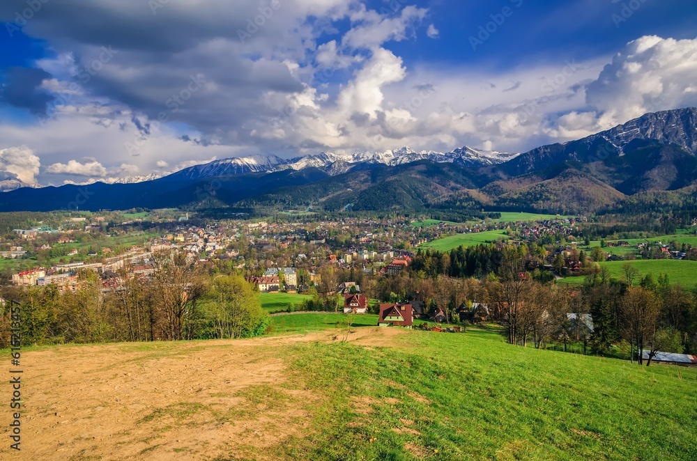 Beautiful country view with mountains in the background. View of the Tatra Mountains, Zakopane Town and Koscielisko Village in Poland.