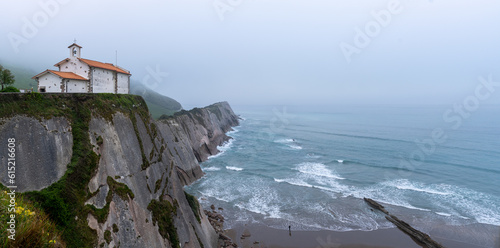 Obraz na plátně Panoramic view of the Hermitage of San Telmo with the Dragonstone cave at the fo