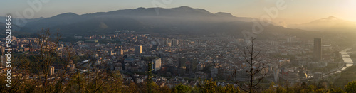 Panoramic view of the city of Bilbao from Mount Artxanda at sunset with a light mist on the horizon