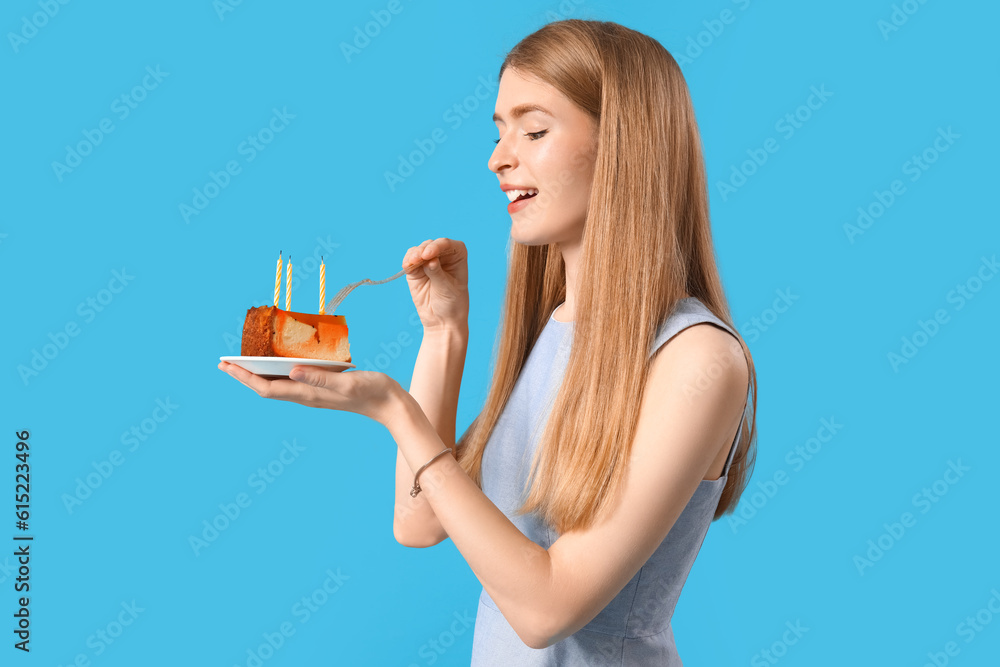 Young woman with piece of birthday cake on blue background Young woman with piece of birthday cake on blue background