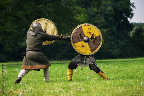 Two fighting viking warriors from early middle ages.