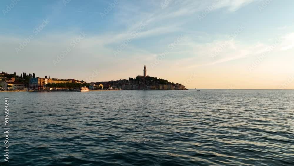 Rovinj, Croatia. Aerial view. Old historic buildings in the bay. Harbor with boats. Beautiful romantic old town of Rovinj during sunset, Istrian peninsula, Croatia, Europe. Rovinj, Croatia. Aerial view. Old historic buildings in the bay. Harbor with boats. Beautiful romantic old town of Rovinj during sunset, Istrian peninsula, Croatia, Europe.