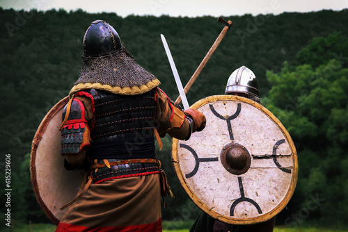 Two fighting viking warriors from early middle ages.