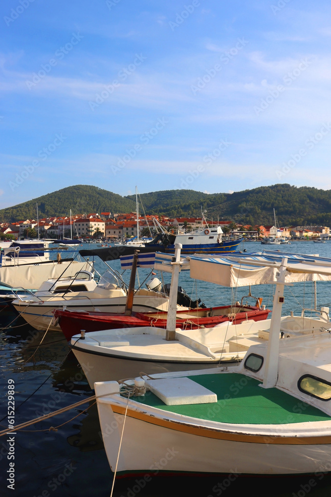Small fishing boat and picturesque skyline in Vela Luka, island Korcula, Croatia.